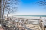 Spacious bluffside deck with outdoor furniture for meals with the ultimate ambiance